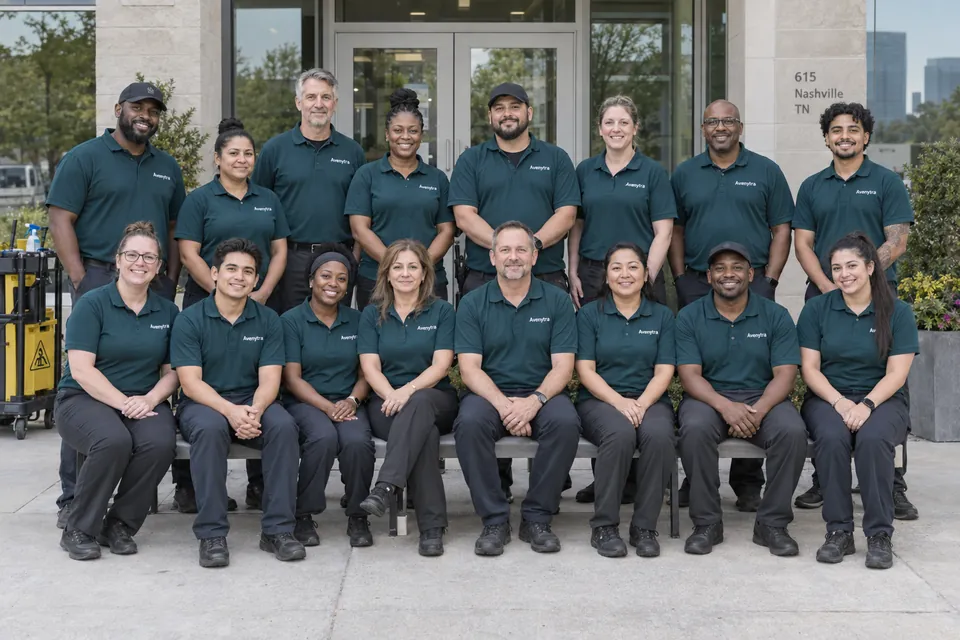 Illustrative portrait of a cleaning crew in teal uniforms